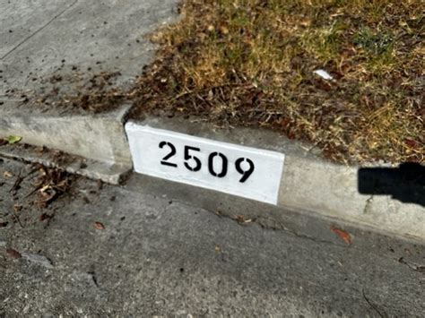 repainting house numbers on curbs